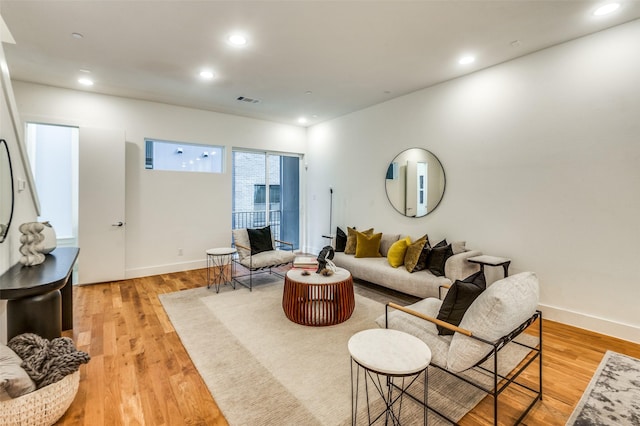 living room with light hardwood / wood-style floors