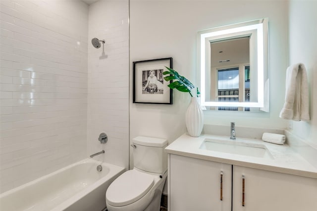 full bathroom with vanity, toilet, and tiled shower / bath