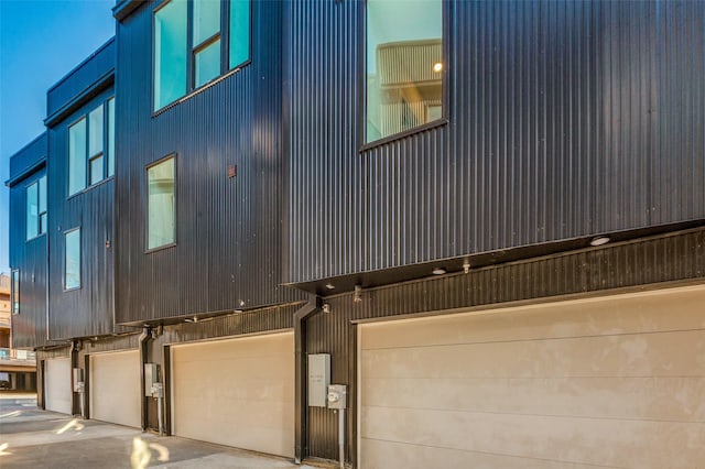 view of side of home featuring a garage