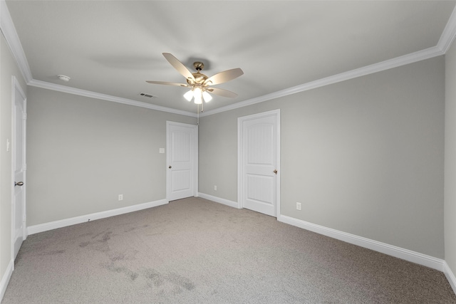 spare room featuring carpet flooring, ceiling fan, and ornamental molding