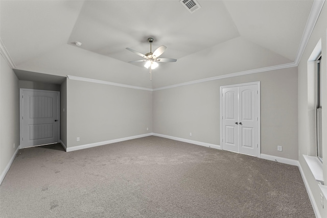 unfurnished bedroom with carpet, ceiling fan, crown molding, and vaulted ceiling