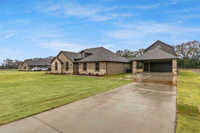 view of front of home with a front yard and a garage