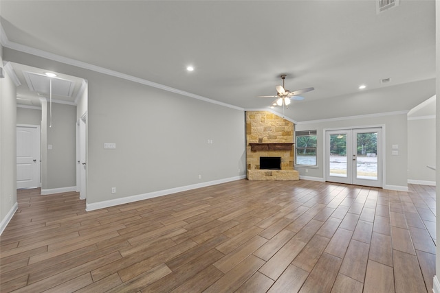 unfurnished living room featuring ceiling fan, light hardwood / wood-style floors, and crown molding