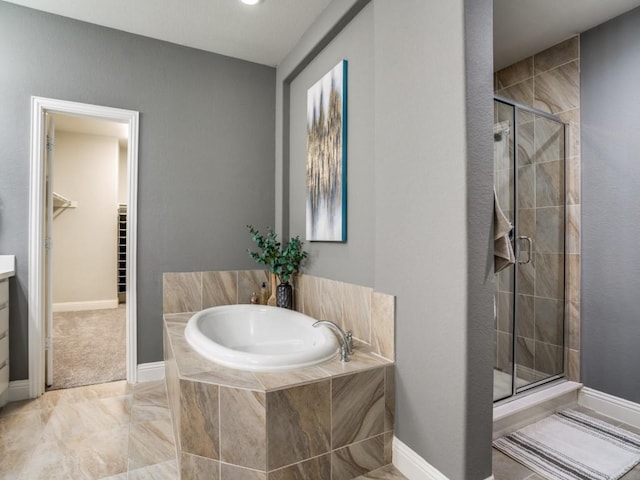 bathroom featuring separate shower and tub