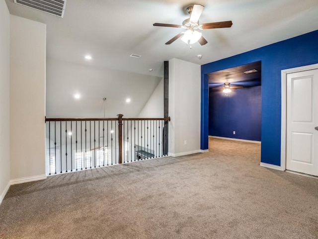 carpeted empty room with ceiling fan