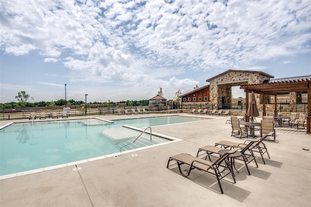 view of pool featuring a patio area and a pergola