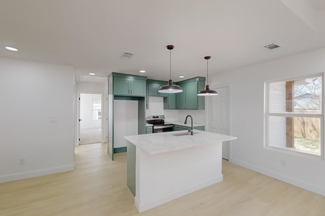 kitchen featuring light stone countertops, sink, pendant lighting, electric range, and green cabinets