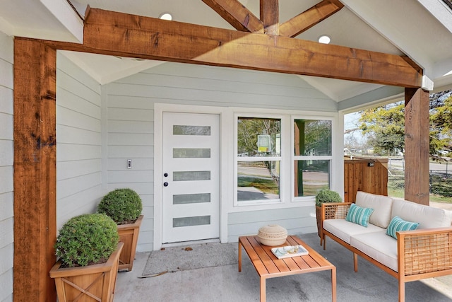 view of exterior entry with an outdoor living space