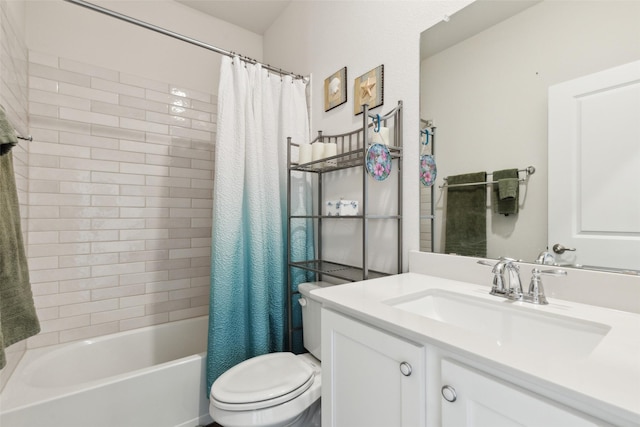 full bathroom with vanity, shower / tub combo, and toilet