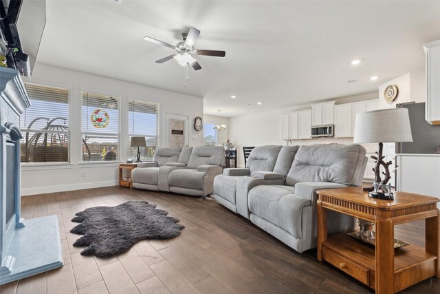 living room with ceiling fan and hardwood / wood-style flooring