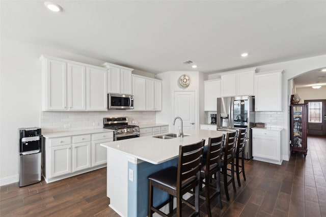 kitchen with white cabinetry, sink, and appliances with stainless steel finishes