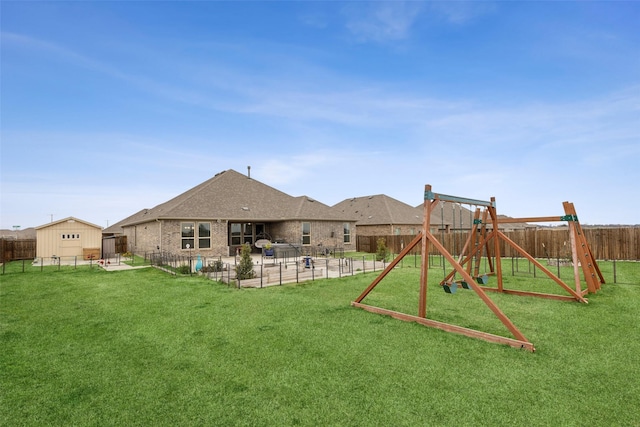 view of play area with a patio area and a yard