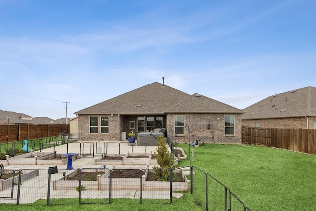 rear view of property featuring a yard