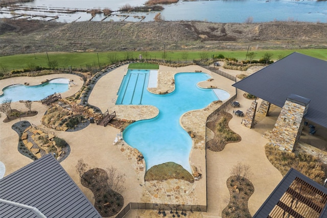 view of pool featuring a water view