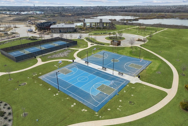 view of basketball court with a water view