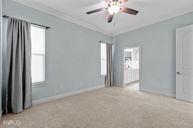 empty room featuring ceiling fan, ornamental molding, and light colored carpet