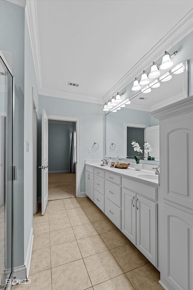 bathroom featuring crown molding, tile patterned floors, vanity, and a shower with shower door