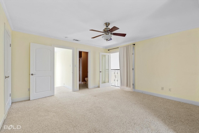 unfurnished bedroom with ceiling fan, ensuite bath, light carpet, and ornamental molding