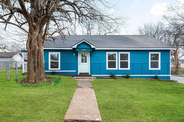 ranch-style home with a front yard