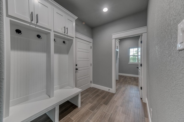 715 Winkler Way, Springtown, TX 76082 - mudroom with dark wood finished floors, baseboards, and recessed lighting