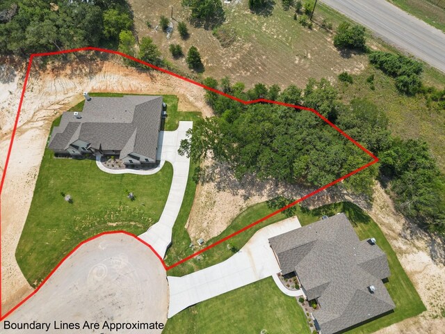 aerial view of property and surrounding area featuring property boundaries highlighted