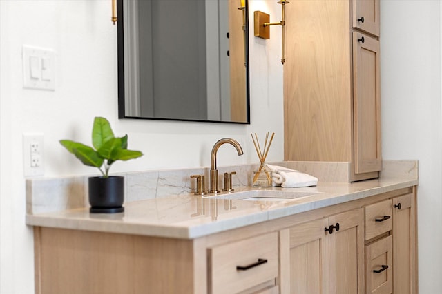 interior space with light brown cabinetry and sink