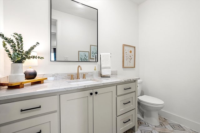 bathroom featuring vanity and toilet