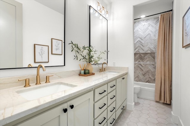 full bathroom featuring tile patterned flooring, vanity, toilet, and shower / bath combo with shower curtain