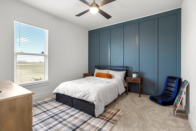 bedroom with light colored carpet and ceiling fan