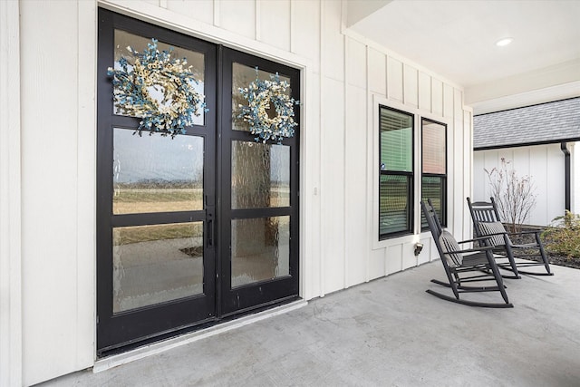 view of exterior entry with covered porch