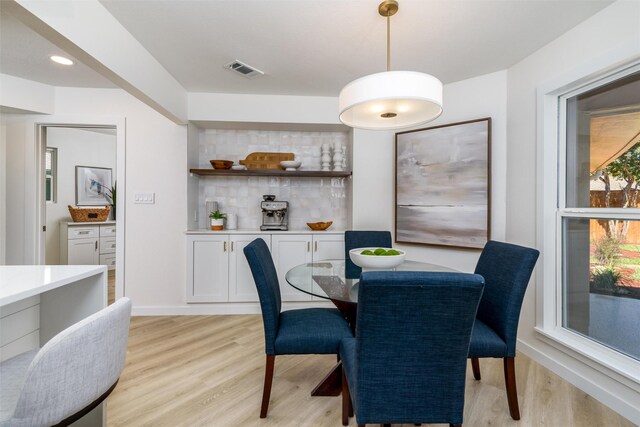 dining area featuring light wood-type flooring