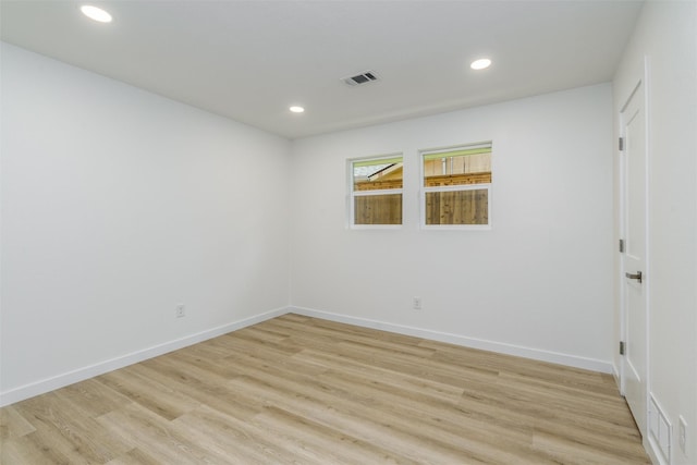 unfurnished room with light hardwood / wood-style flooring