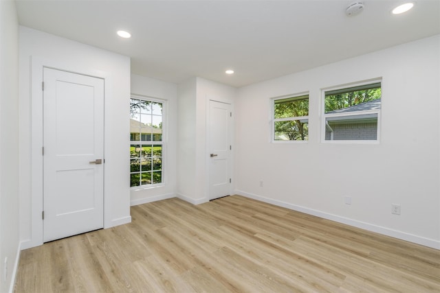 unfurnished room featuring light wood-type flooring