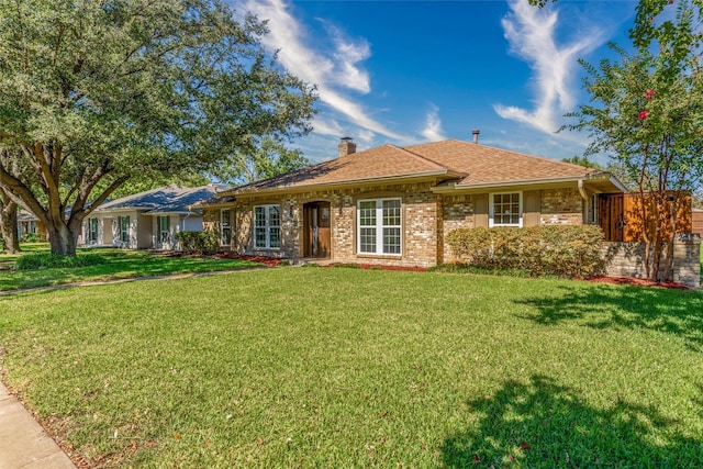 ranch-style house featuring a front yard