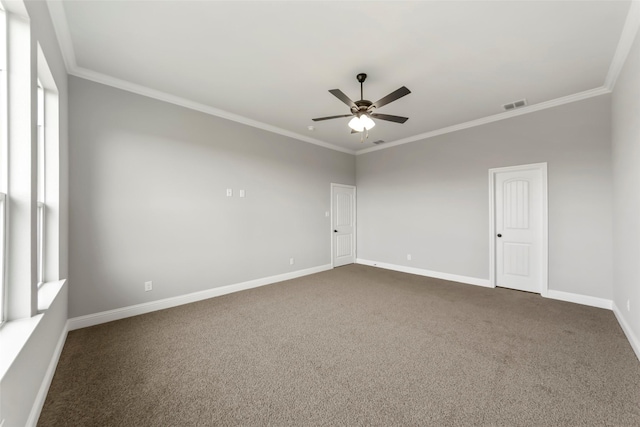 carpeted empty room with ornamental molding and ceiling fan