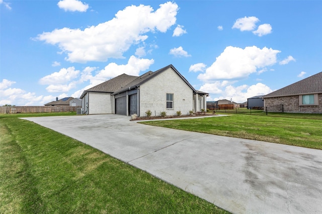 view of property exterior featuring a yard and a garage