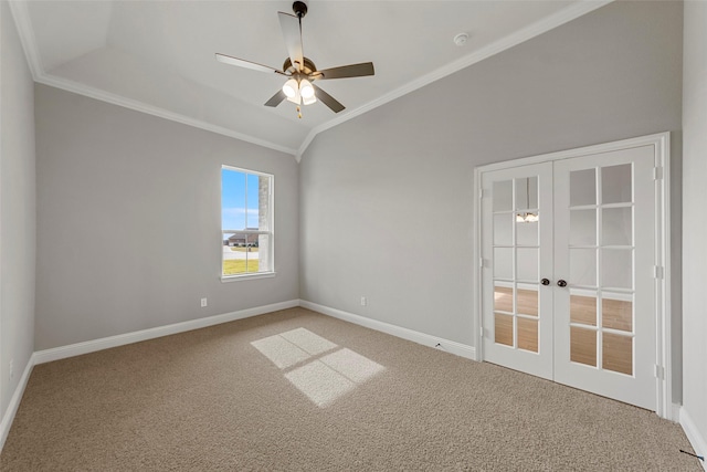 carpeted empty room featuring crown molding, ceiling fan, lofted ceiling, and french doors