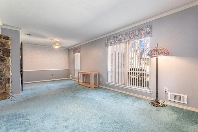 unfurnished living room featuring carpet floors and ornamental molding