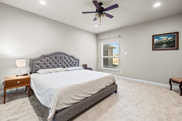 carpeted bedroom with ceiling fan