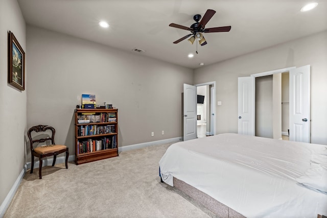 bedroom featuring light carpet and ceiling fan