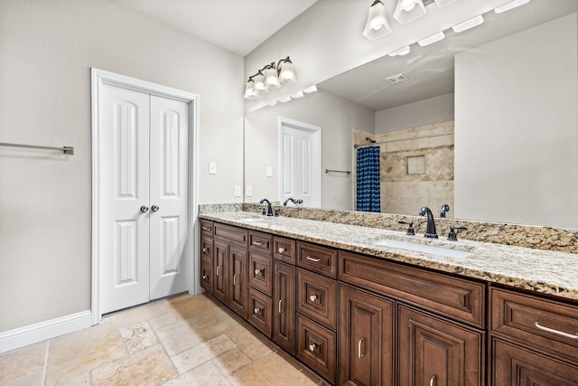 bathroom with a shower with curtain and vanity