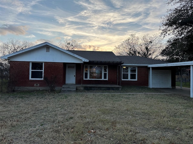 single story home with a carport and a yard