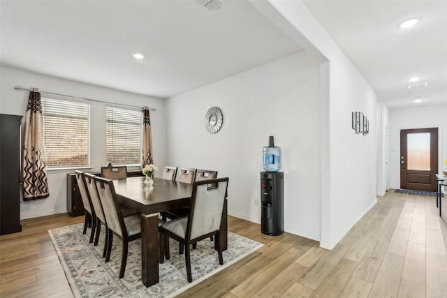 dining area with light hardwood / wood-style floors