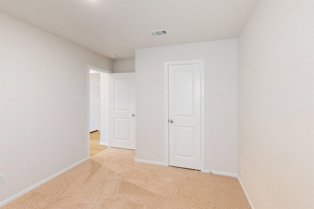 789 Merry Summit Rd, Lavon, TX 75166 - unfurnished bedroom with baseboards, light carpet, and visible vents
