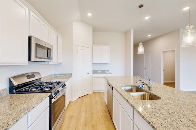 789 Merry Summit Rd, Lavon, TX 75166 - kitchen featuring a sink, white cabinets, stainless steel appliances, and light wood-style flooring