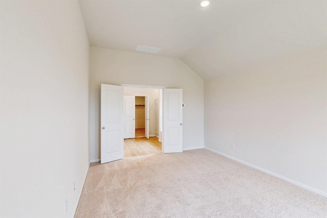 789 Merry Summit Rd, Lavon, TX 75166 - unfurnished bedroom featuring baseboards, a walk in closet, light colored carpet, recessed lighting, and vaulted ceiling