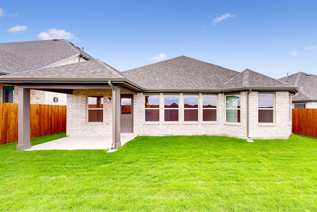 789 Merry Summit Rd, Lavon, TX 75166 - back of property with a patio, a fenced backyard, roof with shingles, and brick siding