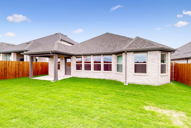 789 Merry Summit Rd, Lavon, TX 75166 - rear view of house featuring a yard, roof with shingles, a fenced backyard, and a patio area