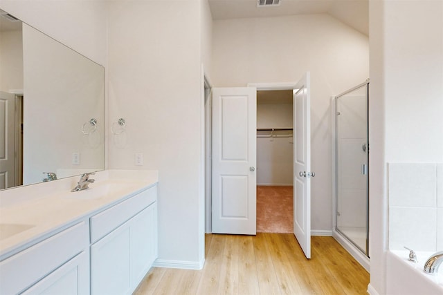 789 Merry Summit Rd, Lavon, TX 75166 - full bathroom featuring a sink, a shower stall, wood finished floors, and a bath