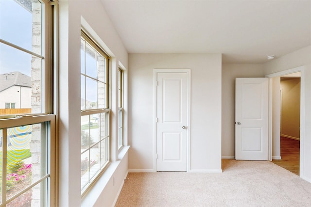 789 Merry Summit Rd, Lavon, TX 75166 - unfurnished bedroom with baseboards, multiple windows, and carpet